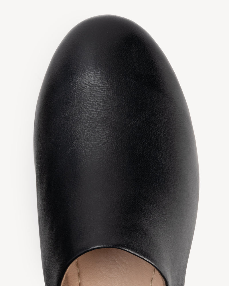Close-up detail of The At-Leisure Slip-On 2.0 Black in smooth leather. Sizes 5–12, wide available