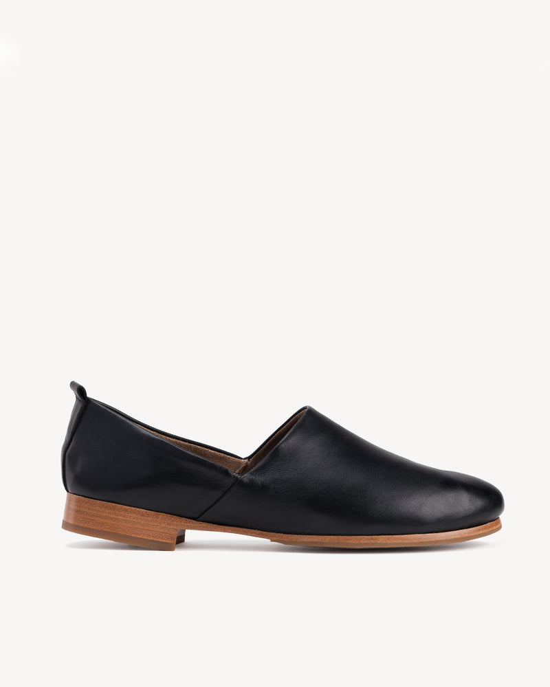 Side view of The At-Leisure Slip-On 2.0 Black in smooth leather. Sizes 5–12, wide available