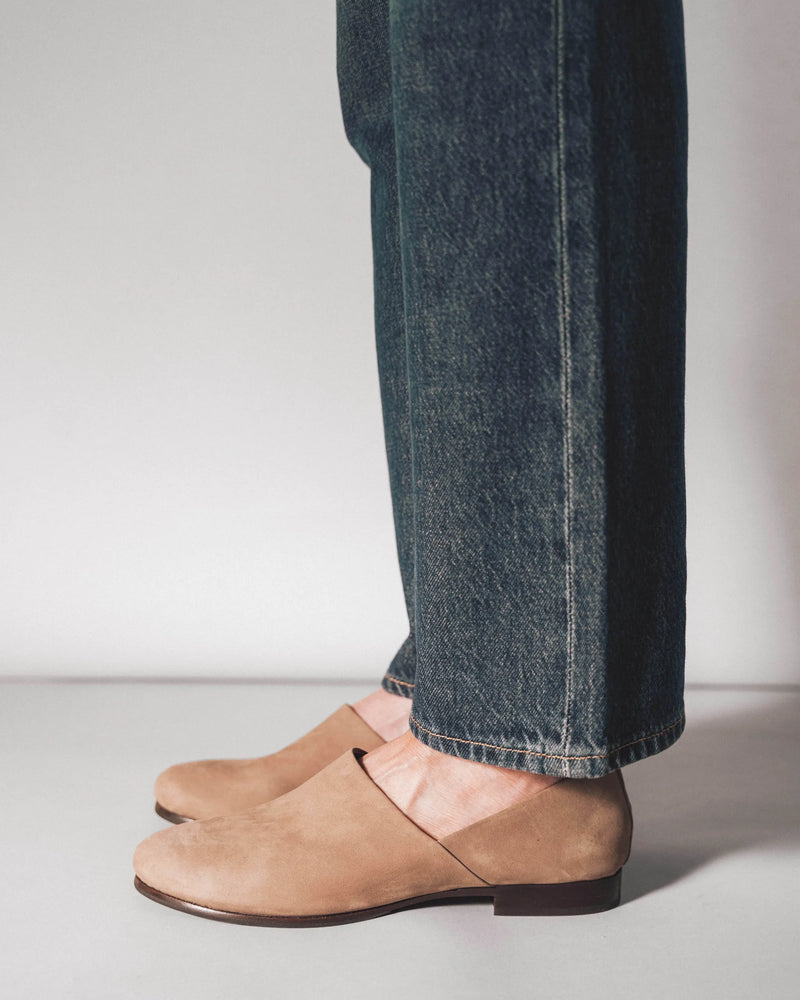 Slip-on shoes, side view with dark jeans. The At-Leisure Slip-On 2.0 Clay Nubuck. Sizes 5–12, available in wide.
