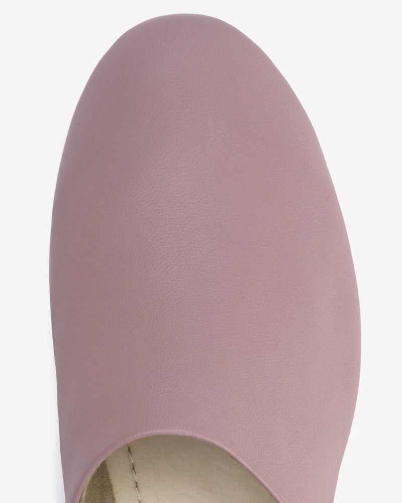 Close-up of the rounded toe showing soft leather grain. The At-Leisure Slip-On 2.0 Dusty Mauve. Sizes 5–12, wide available.