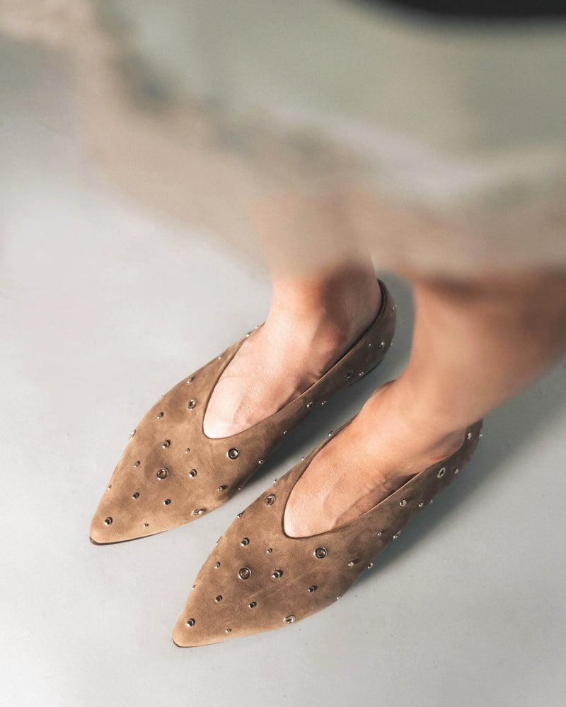 Clay nubuck pointed-toe flats with silver studs, overhead view. The Atelier Flat Clay Studded. Sizes 5–12, available in wide.
