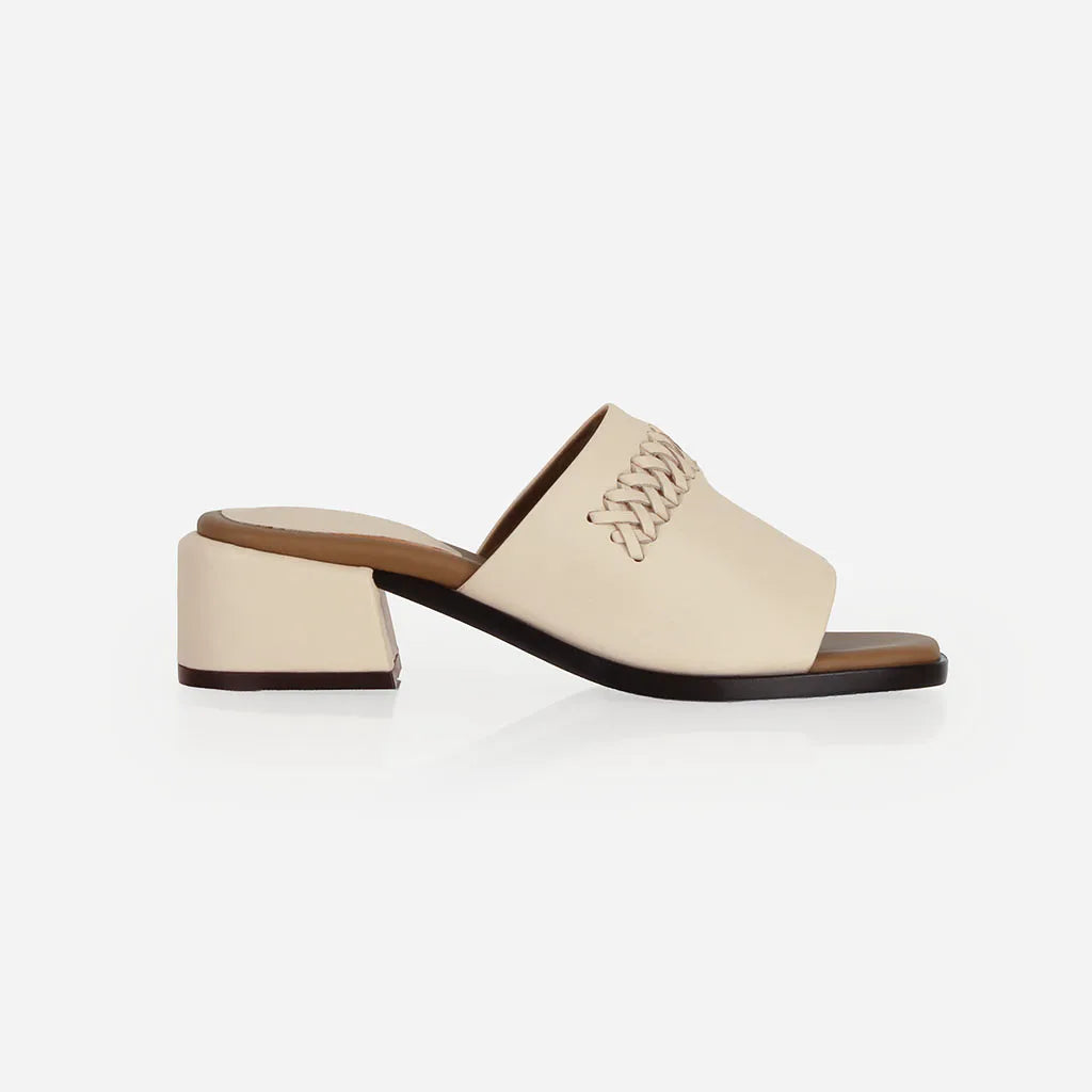 Heel detail of The Bohème Heeled Sandal Oat Milk in White smooth leather. Sizes 5–12, wide available