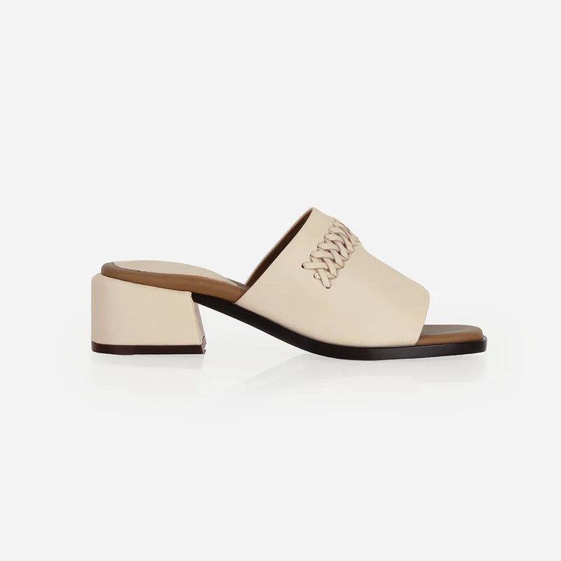 Heel detail of The Bohème Heeled Sandal Oat Milk in White smooth leather. Sizes 5–12, wide available