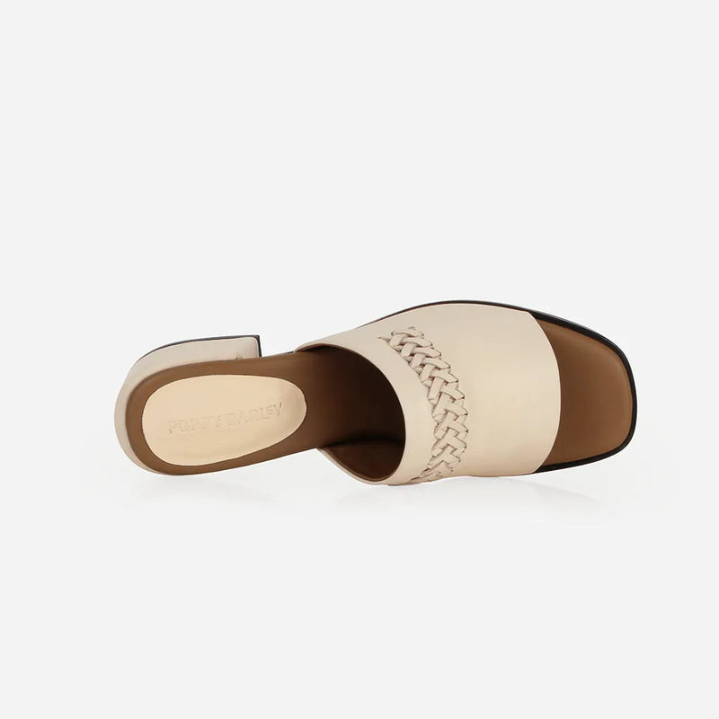 Heel detail of The Bohème Heeled Sandal Oat Milk in White smooth leather. Sizes 5–12, wide available