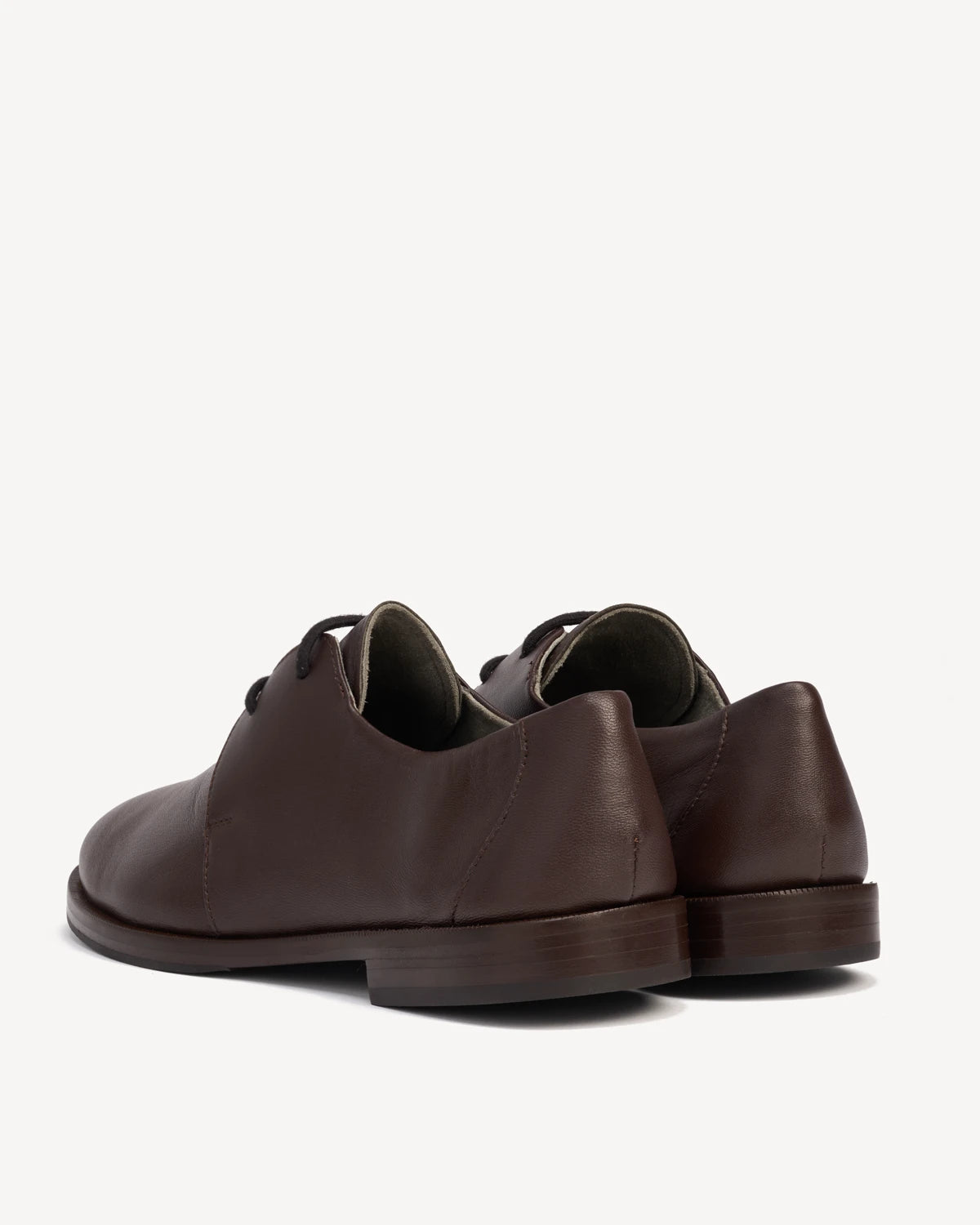 Back angle view of a pair of lace-up oxfords. The Capsule Oxford Cocoa Plum. Sizes 5–12, wide available.
