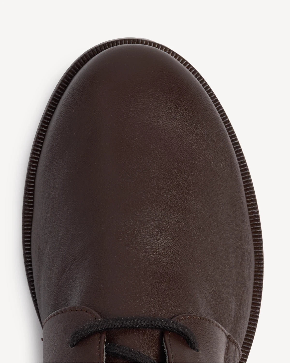 Close-up of the leather toe cap and stitched sole. The Capsule Oxford Cocoa Plum. Sizes 5–12, wide available.