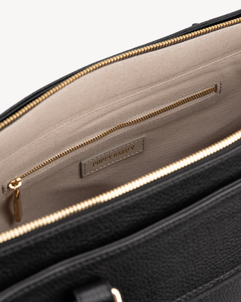 Close-up detail of The Colleague Tote Black in leather