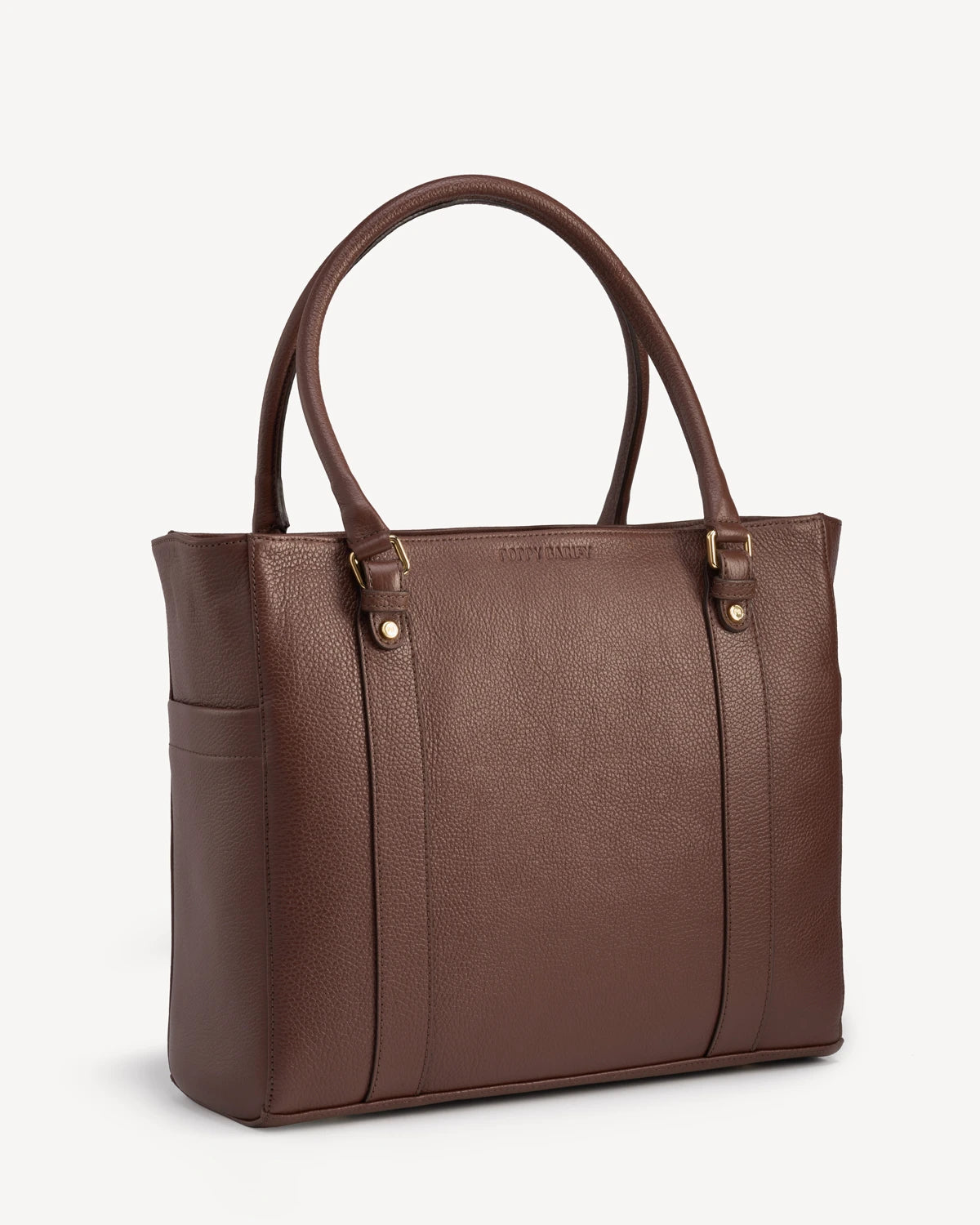 Side view of the structured leather tote with double top handles. The Colleague Tote French Press.