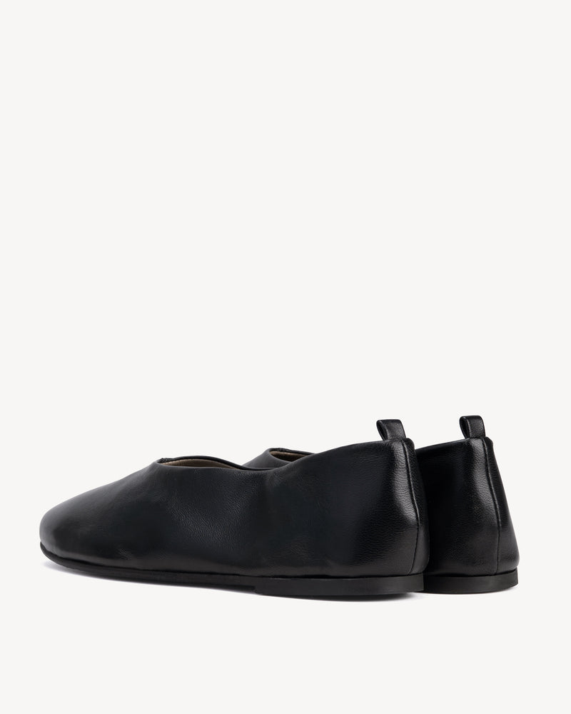 Back view of The Contemporary Ballet Flat Black in smooth leather. Sizes 5–12