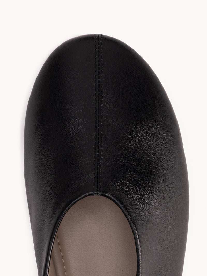 Close-up detail of The Contemporary Ballet Flat Black in smooth leather. Sizes 5–12