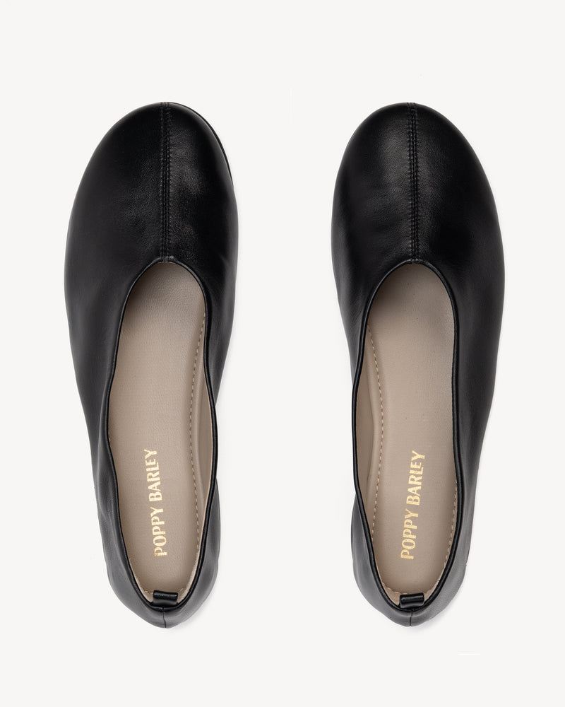 Top view of The Contemporary Ballet Flat Black in smooth leather. Sizes 5–12