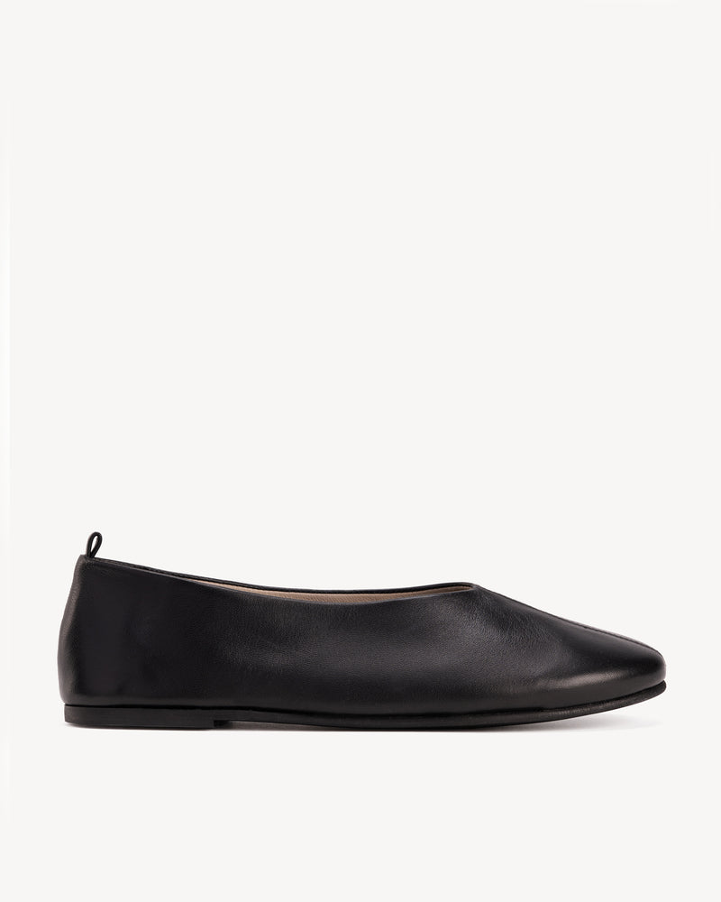 Side view of The Contemporary Ballet Flat Black in smooth leather. Sizes 5–12