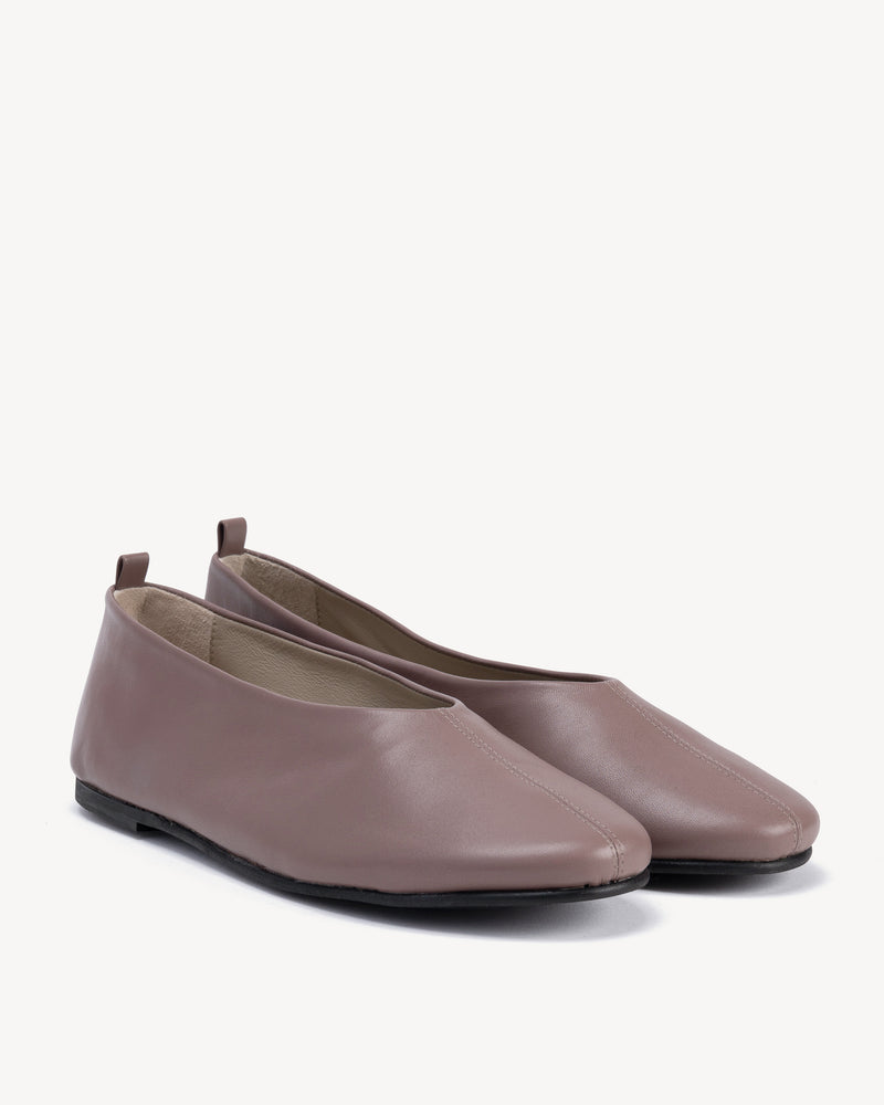 Angled view of The Contemporary Ballet Flat Ceramic in Purple, Neutral smooth leather. Sizes 5–12
