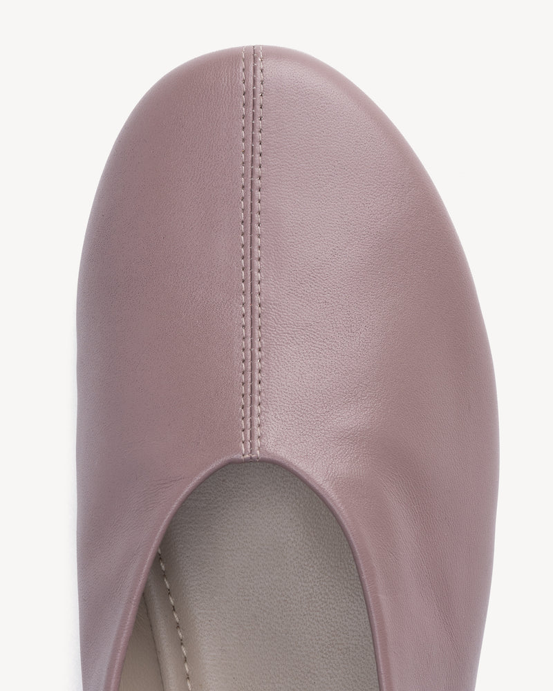 Close-up detail of The Contemporary Ballet Flat Ceramic in Purple, Neutral smooth leather. Sizes 5–12