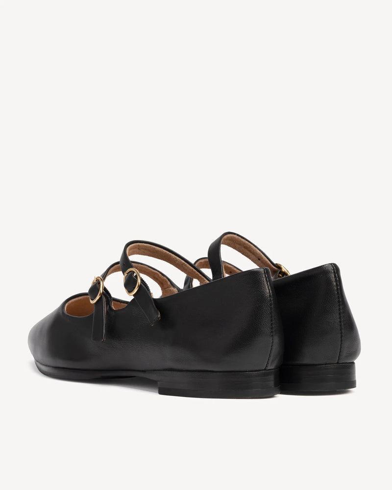 Back view of crisscross strap on pointed flats. The Editorial Mary Jane 2.0 Black. Sizes 5–12, wide available.