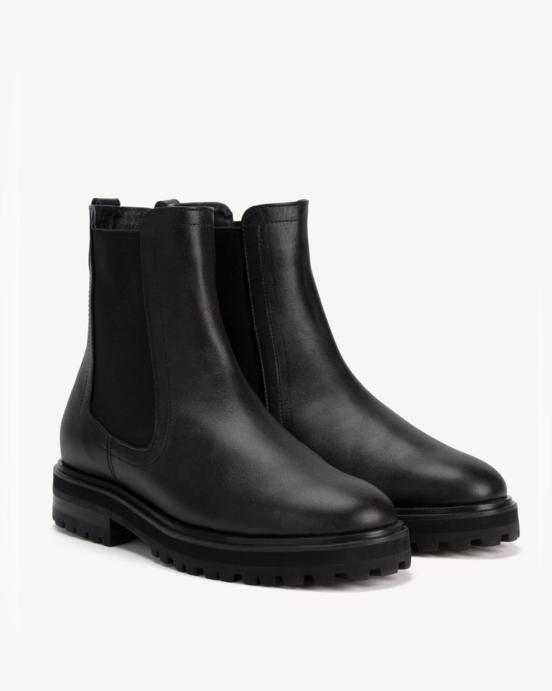 Angled view of The Every Way Chelsea Boot Black Water Resistant in Black smooth leather. Sizes 5–12, wide available
