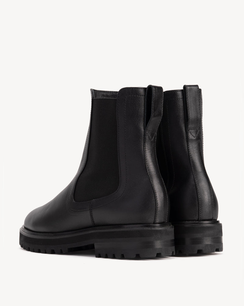 Back view of The Every Way Chelsea Boot Black Water Resistant in Black smooth leather. Sizes 5–12, wide available