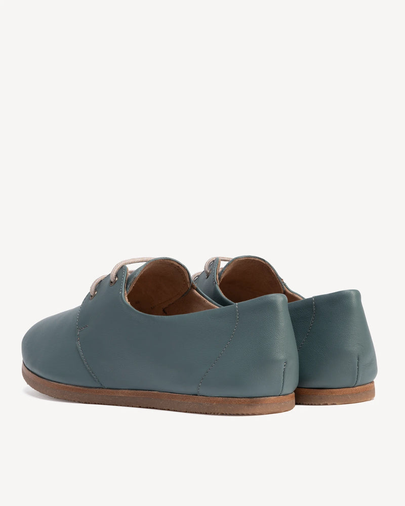 Back view of lace-up oxford flats. The Eyelet Oxford 2.0 Storm. Sizes 5–12, wide available.