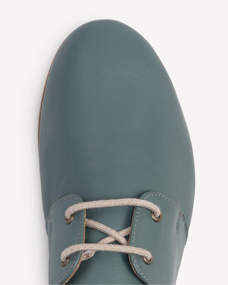 Close-up of laces and rounded toe on oxford flat. The Eyelet Oxford 2.0 Storm. Sizes 5–12, wide available.