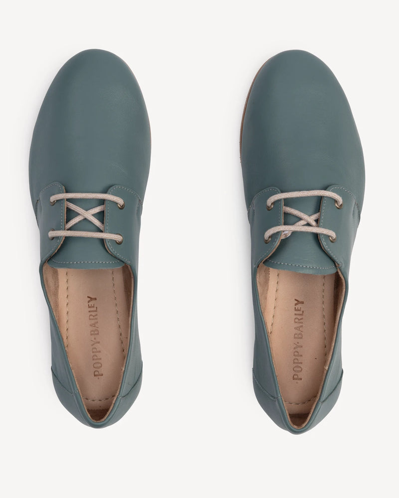 Overhead view of lace-up oxford flats. The Eyelet Oxford 2.0 Storm. Sizes 5–12, wide available.