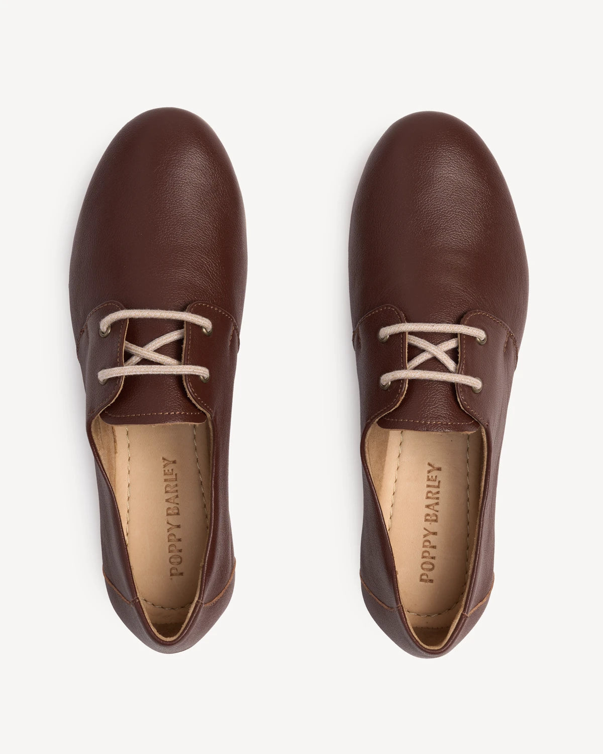 Overhead view of pebbled-leather oxfords with eyelets. The Eyelet Oxford 2.0 French Press. Sizes 5–12, wide available.
