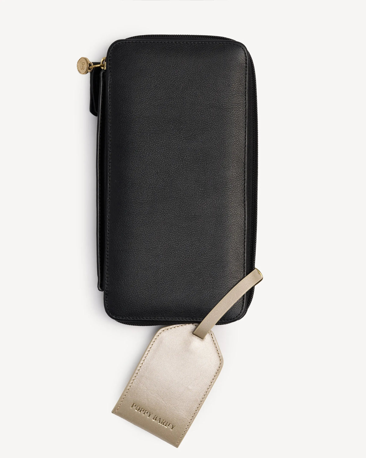 Zip-around passport wallet shown with its attached luggage tag. The Flying Solo Passport Holder & Slim Luggage Tag Set Black.