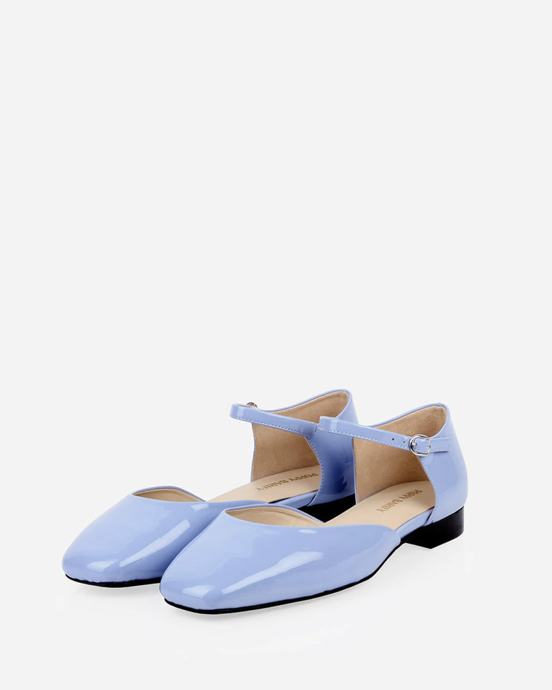 Angled pair view showing the ankle straps and buckles. The Gallery Mary Jane Cornflower Patent. Sizes 5–12.