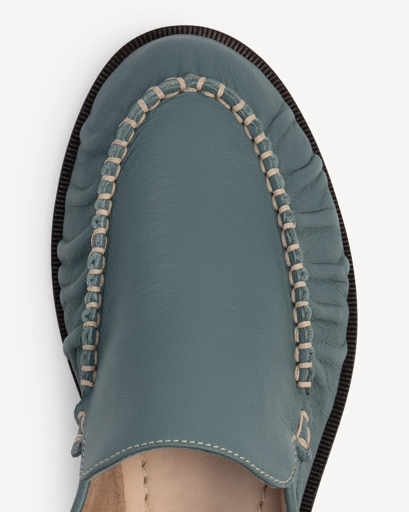 Close-up of ruched vamp and beaded chain trim. The Laid Back Loafer Storm. Sizes 5–12, wide available.