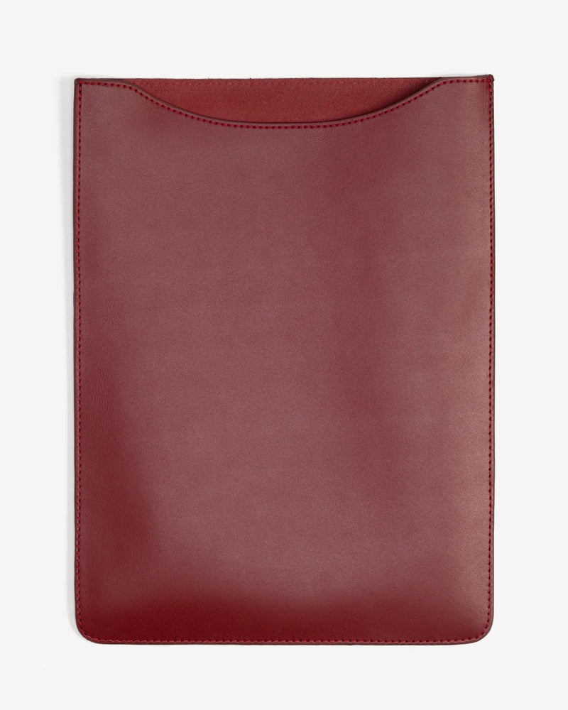 Back view of a flat rectangular leather laptop sleeve. The Laptop Sleeve Resort Red.