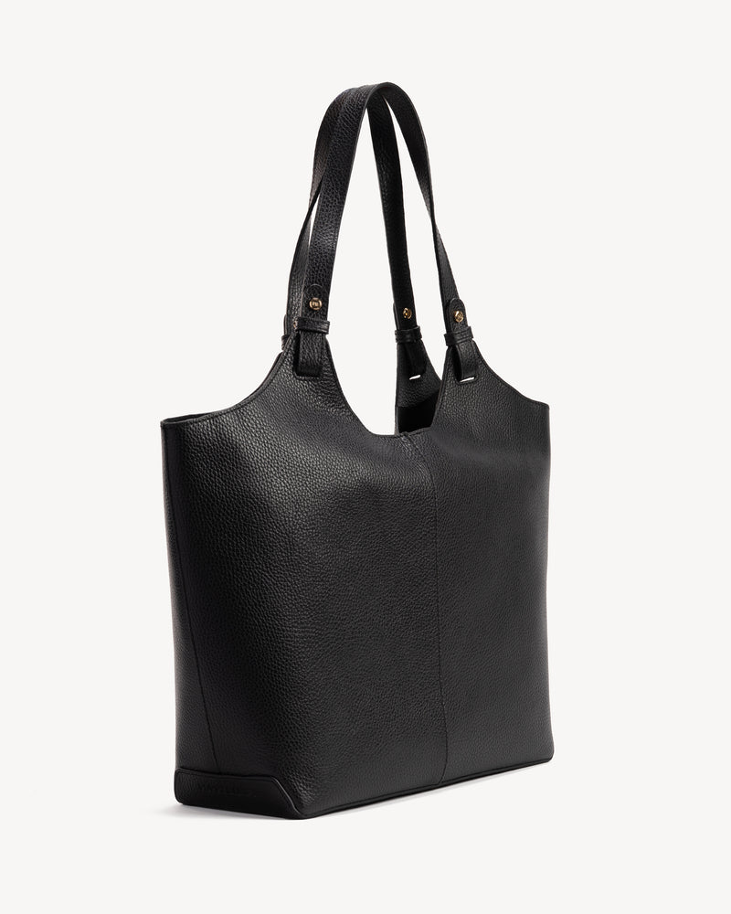 Angled view of The Lisboa Tote Black in pebbled leather