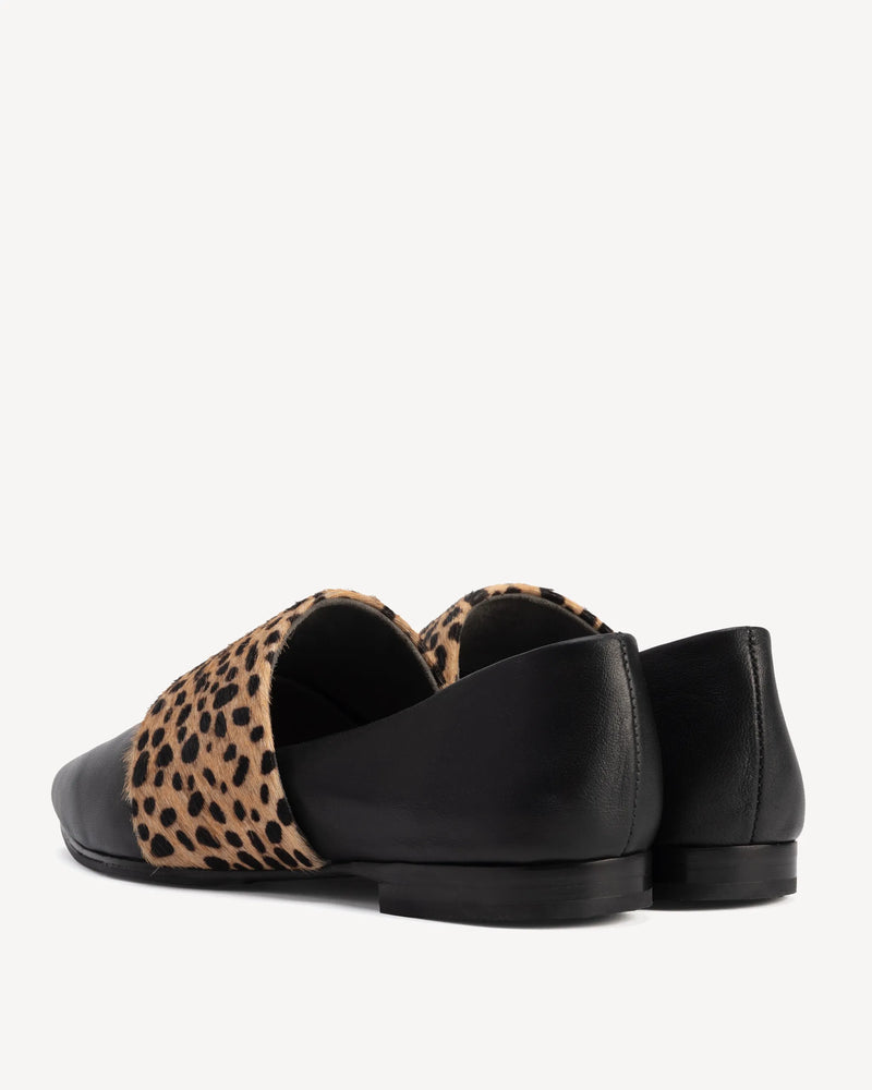 Back view of flats with calf hair band. The Luxe Fit Flat Black and Cheetah Calf Hair. Sizes 5–12, wide available.