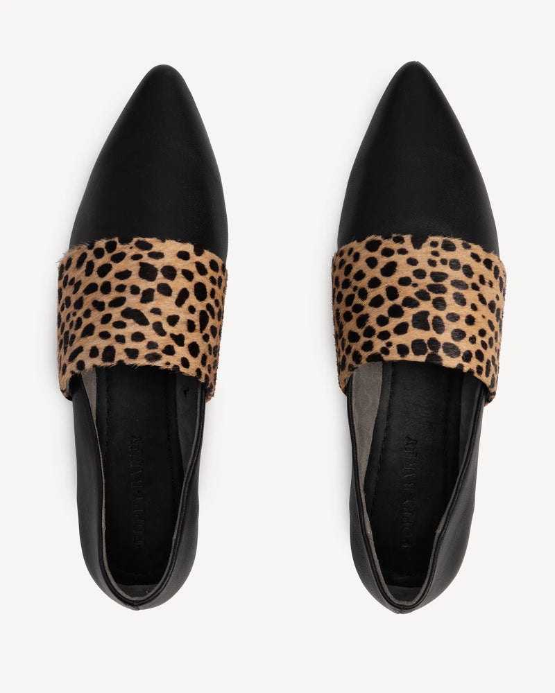 Top-down view of flats with calf hair band. The Luxe Fit Flat Black and Cheetah Calf Hair. Sizes 5–12, wide available.