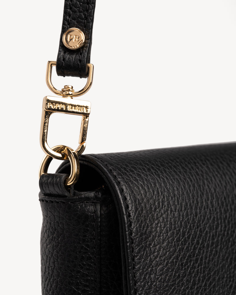 Close-up detail of The Medium Day to Night Bag Black Pebble in leather