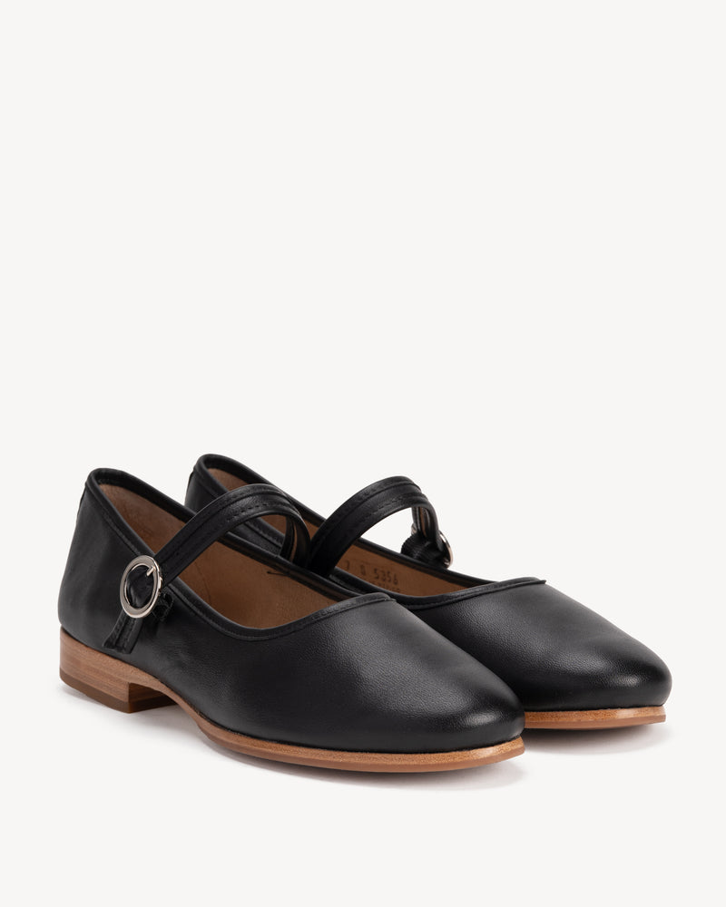 Angled view of The Modern-Day Mary Jane Black in smooth leather. Sizes 5–12, wide available