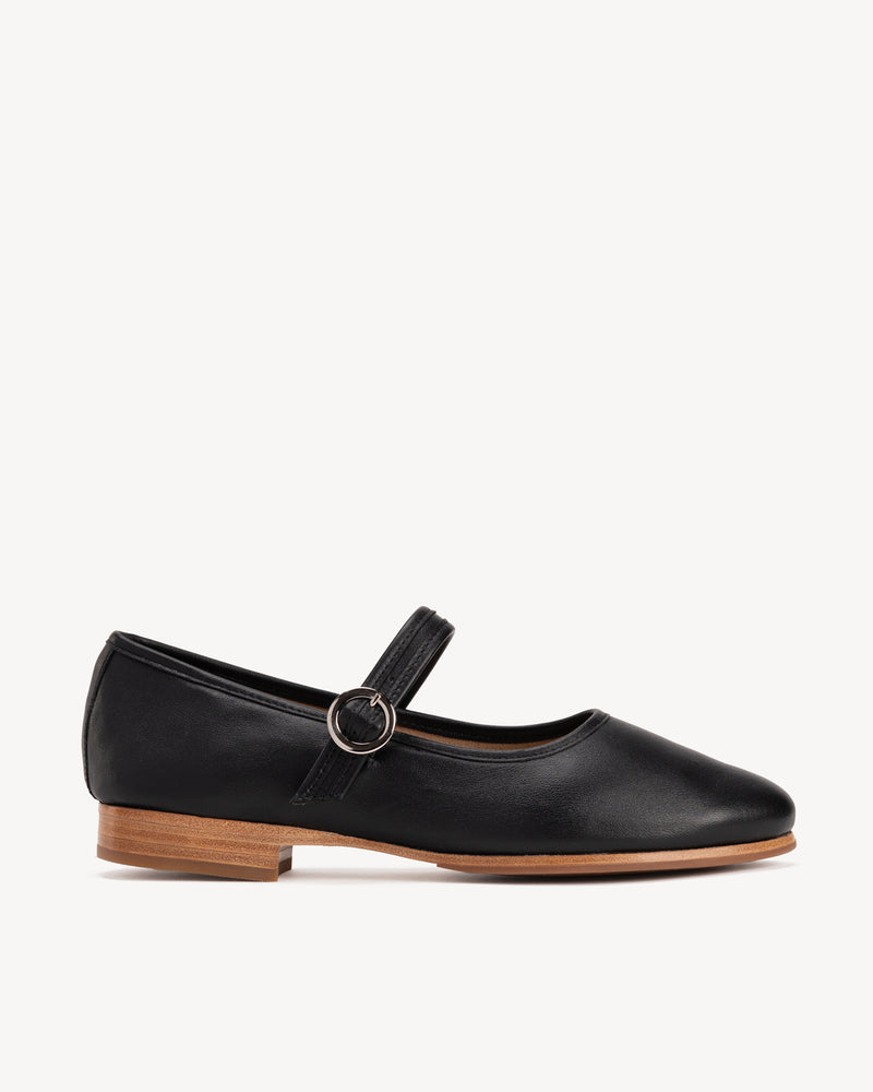 Side view of The Modern-Day Mary Jane Black in smooth leather. Sizes 5–12, wide available