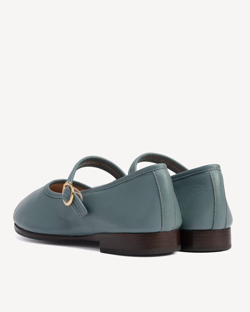 Back view showing single strap and buckle on round-toe flats. The Modern Day Mary Jane Storm. Sizes 5–12.