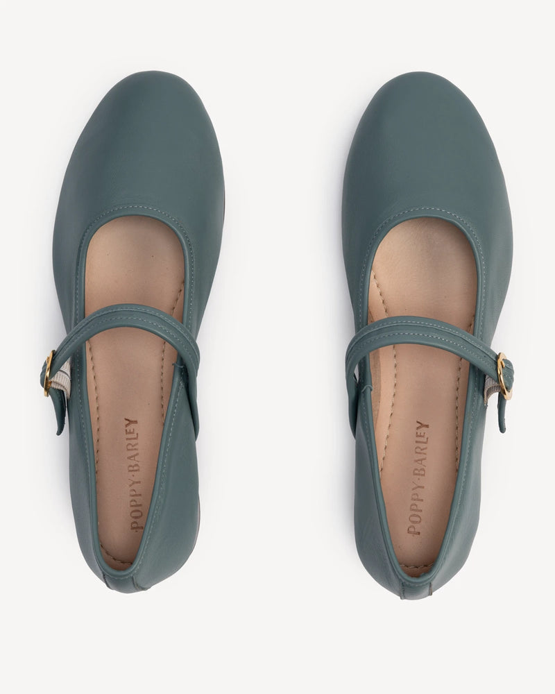 Overhead view of round-toe flats with single strap. The Modern Day Mary Jane Storm. Sizes 5–12.