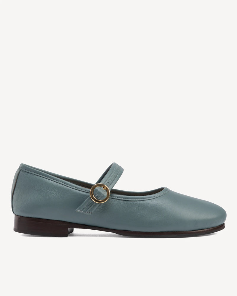 Side view of round-toe flat with single buckle strap. The Modern Day Mary Jane Storm. Sizes 5–12.