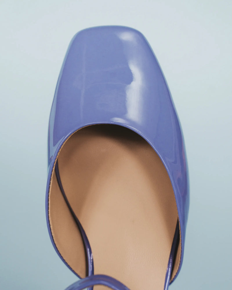 Extreme close-up from above of the toe and d'orsay vamp cutout. The Gallery Mary Jane Cornflower Patent. Sizes 5–12.