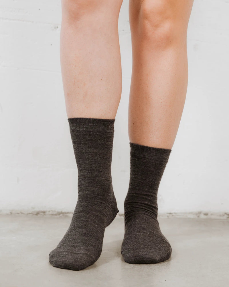 On-foot view of slouchy crew socks in a heathered wool-blend knit. The Dressy Crew Sock Charcoal Melange.