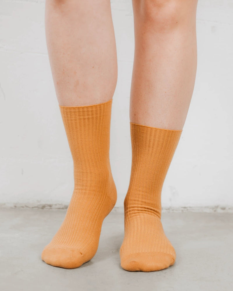 Front view of ribbed crew socks, cotton-rich knit with a folded cuff. The Ribbed Crew Sock Ochre.