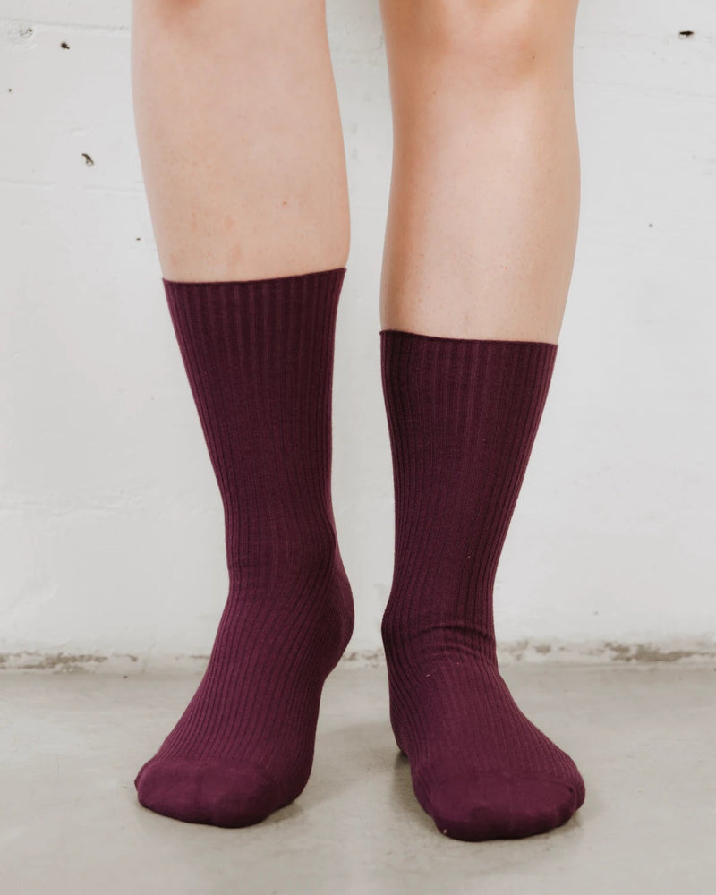 Front view of ribbed mid-calf socks, cotton-rich rib knit with a folded cuff. The Ribbed Crew Sock Cassis.