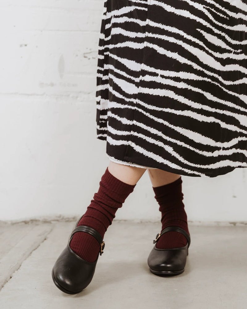 Styled with a zebra-print skirt and mary janes, ribbed knit peeking above the shoe. The Ribbed Crew Sock Sangria.