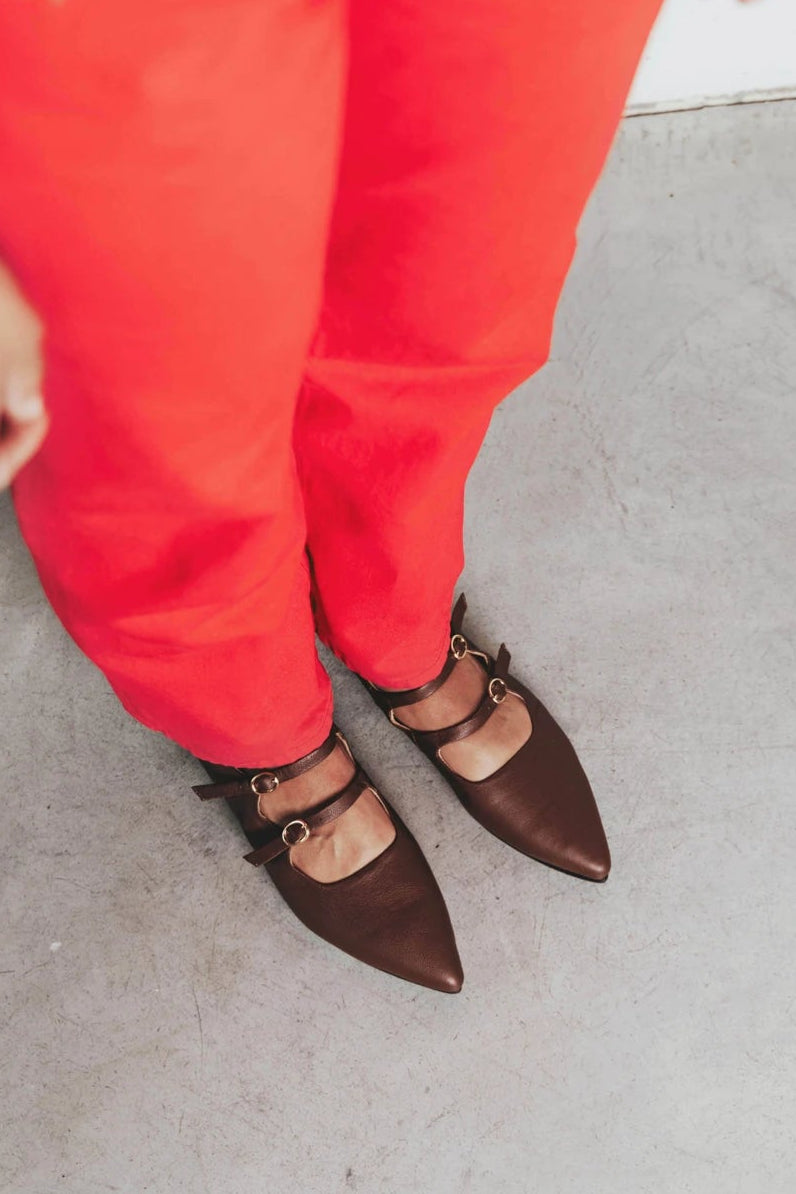 Feet in pointed-toe flats with double straps. The Editorial Mary Jane 2.0 French Press. Sizes 5–12, wide available.