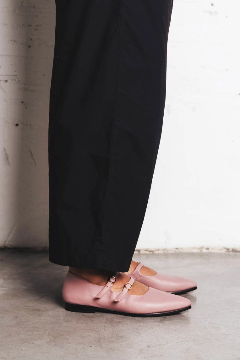 Leg shown wearing pointed-toe flats with double straps. The Editorial Mary Jane 2.0 Dusty Mauve. Sizes 5–12.