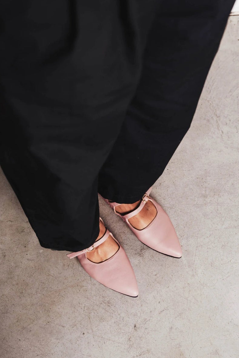 Feet in pointed-toe flats with double straps. The Editorial Mary Jane 2.0 Dusty Mauve. Sizes 5–12.