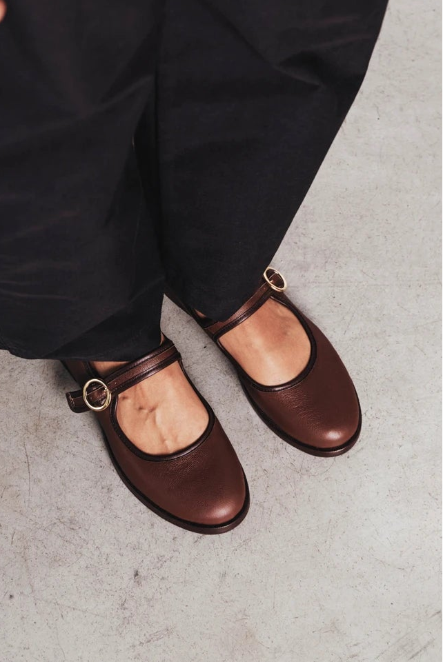 Feet shown wearing round-toe flats with single buckle strap. The Today Mary Jane French Press. Sizes 5–12.