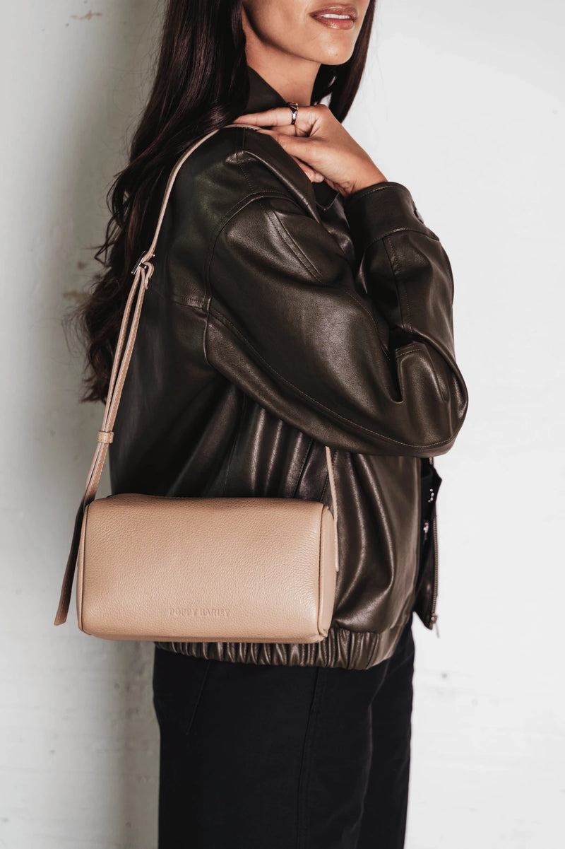 Bag worn crossbody over the shoulder. The Annex Bag Biscotti.