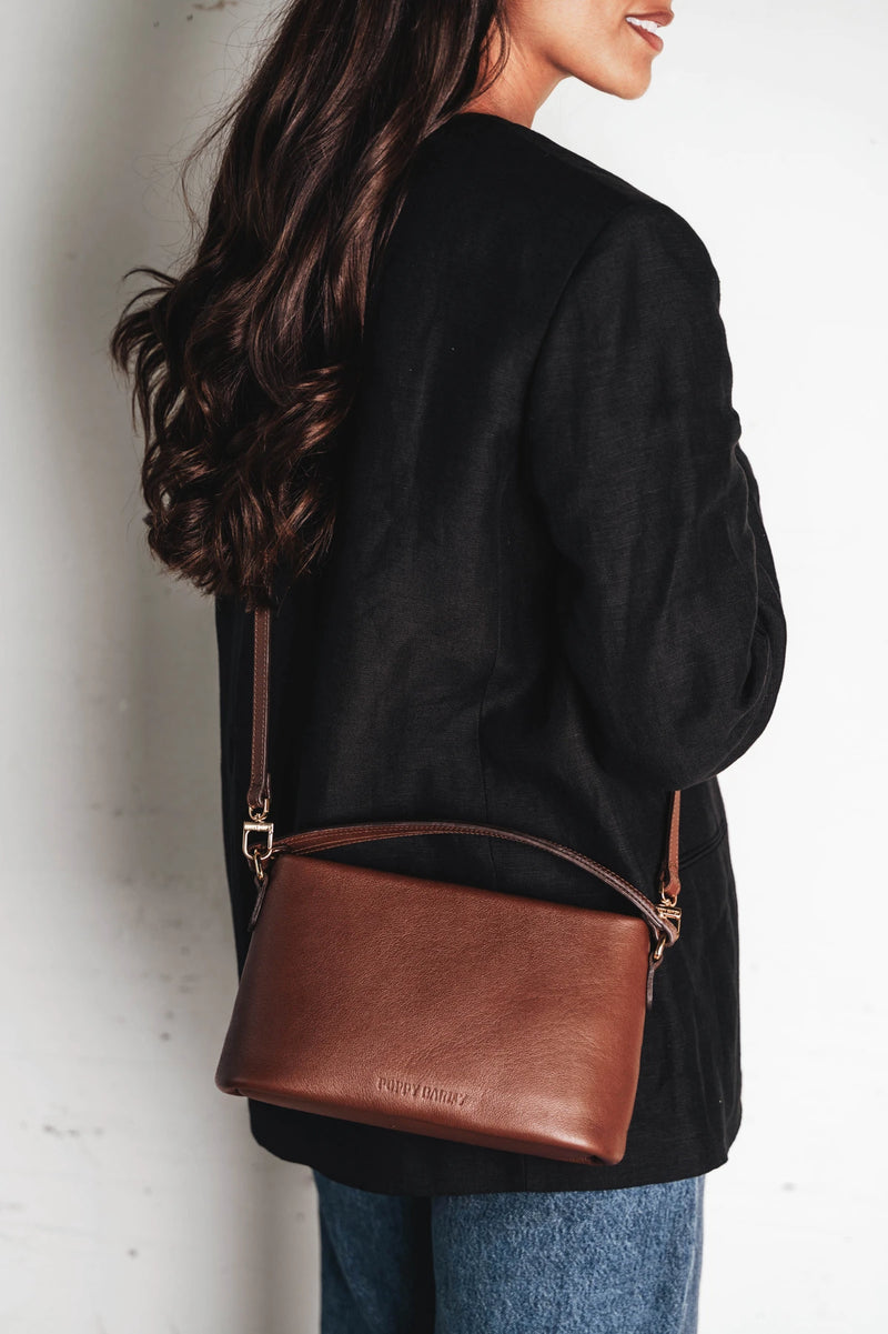 Bag worn crossbody over the shoulder. The Via Monte Bag French Press.