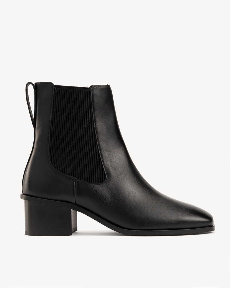 Side view of The Quinn Chelsea Boot Black in smooth leather. Sizes 5–12